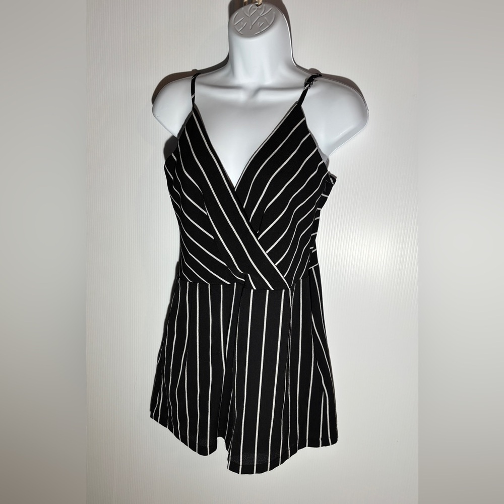 Black and white  romper shorts spaghetti straps
 Size medium